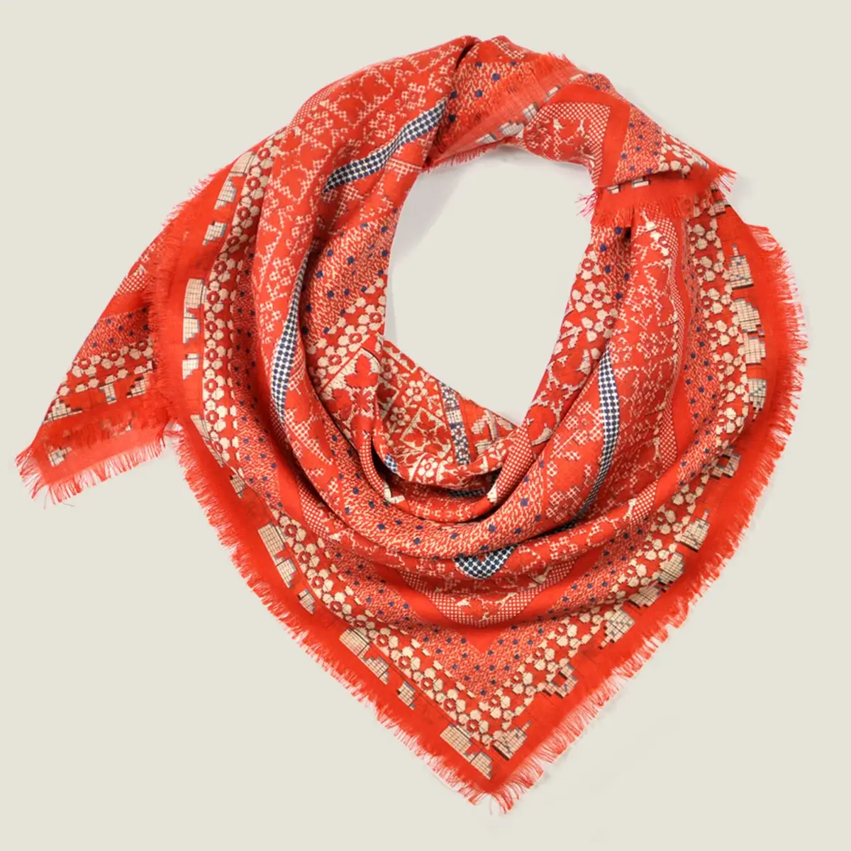 The Nordic Folk wool silk scarf, coiled and shown flat