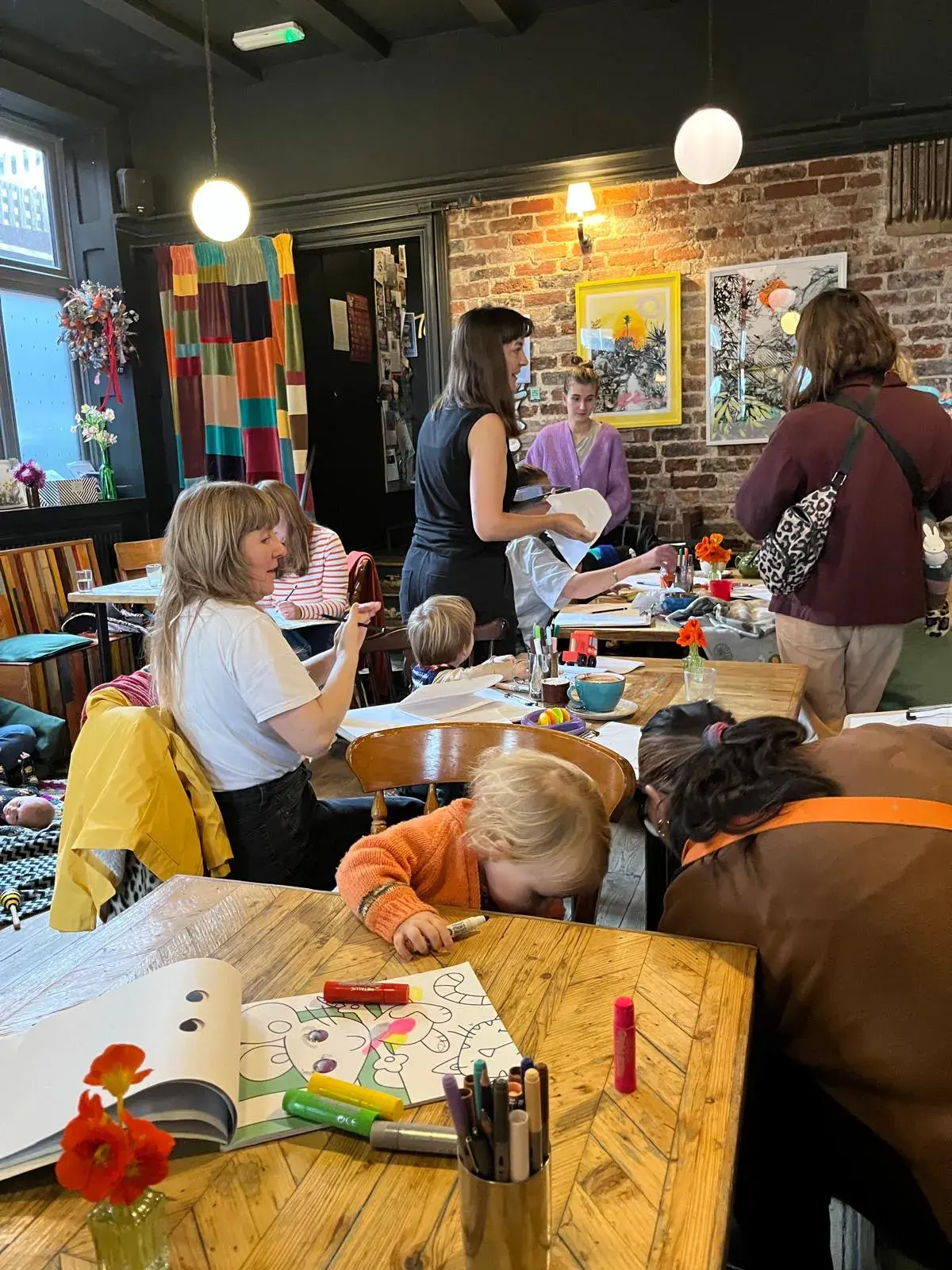 Nicola Jones leading one of her workshops, working with participants around a table